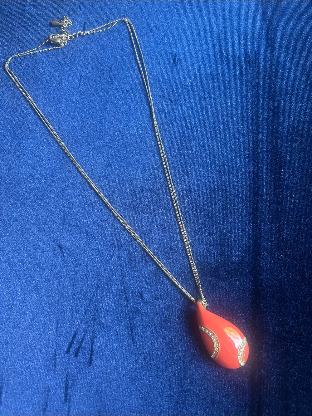 Silver-Tone Necklace with Red Teardrop Pendant and Crystal Swirl